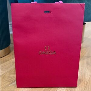 Omega Bright Red Gift Tote with Gold Logo